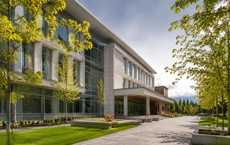 A modern university campus building with a landscaped forecourt in Abbotsford BC