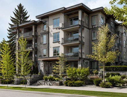 A four storey condo building with glass balconies, condos for sale in Cloverdale, Surrey
