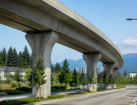 A new construction building beside an elevated SkyTrain guideway near Clayton, Surrey