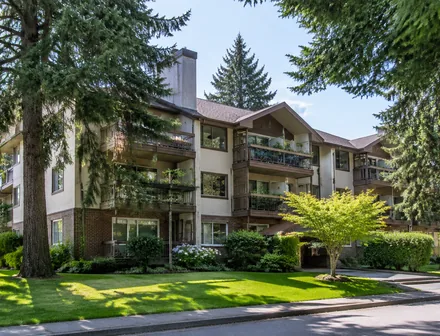 A low rise condo building among mature trees, condos for sale in Ocean Park, South Surrey