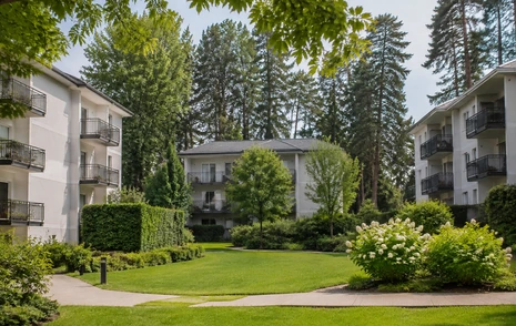 A low rise condo building with glass balconies, condos for sale in Guildford, Surrey BC
