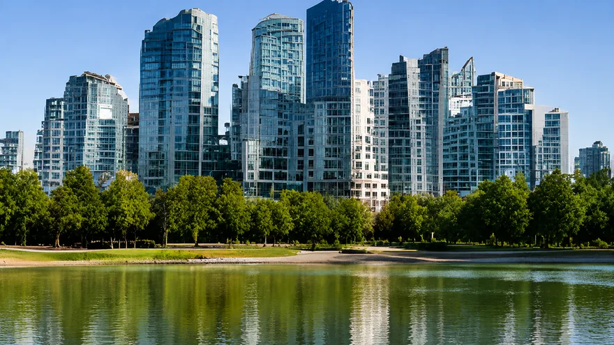 Glass residential towers above a park and a still lake, homes for sale in Surrey BC